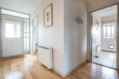 Welcoming hallway as you enter the property and space for boots and coats