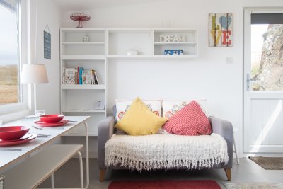 Cosy sofa and books for guests to browse