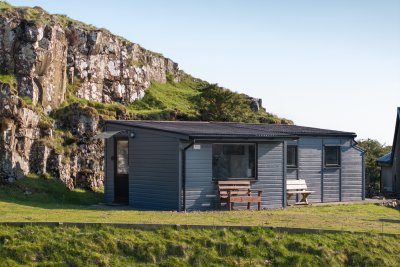 The Pod tucked in beside the rocky outcrop