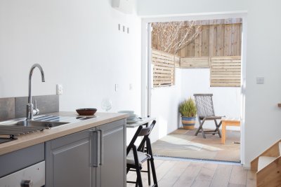 Kitchen with double doors leading outside