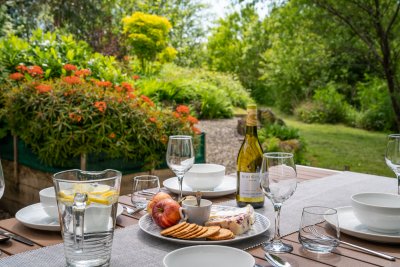 Alfresco dining in the private and beautifully planted garden