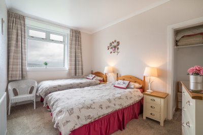 The cosy twin bedroom with plenty of storage to unpack and feel at home