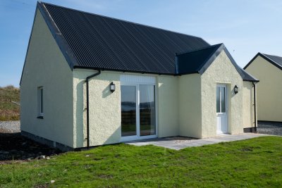 Tigh Buidhe and the surrounding front garden with sea views