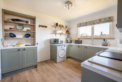 The modern kitchen is well-equipped for all your self-catering needs