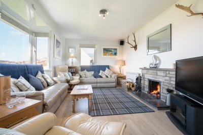 The open fire adds character to this coastal cottage