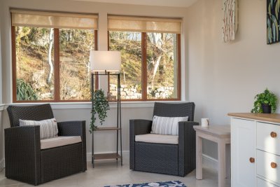 Curl up with a book while casting a gaze out to sea too