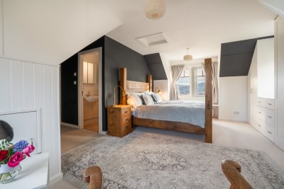 The master bedroom is spacious with superb sea views