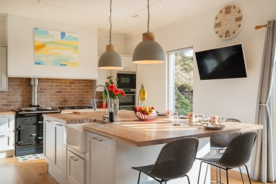 The kitchen island promises the perfect gathering point for morning coffee or a glass of wine