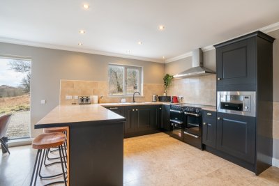 The modern fitted kitchen at Torrness will delight chefs with a large range cooker