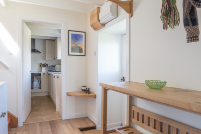 A roomy entrance hall with plenty of space for hiking boots and binoculars