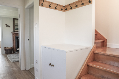 A winding staircase leads to the bedrooms