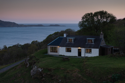 The sun sets over Tostary Cottage