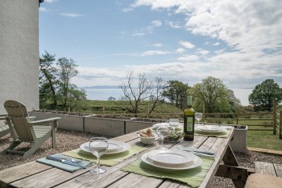 Enjoy dinner alfresco with a superb sea view to outlying isles