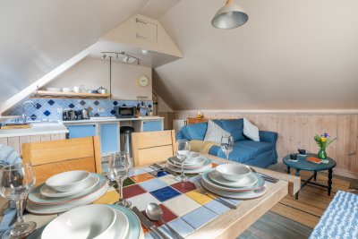 Another view of the cosy living, dining and kitchen area