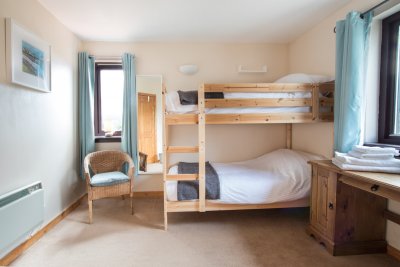 Bunk room at Willowbank - please note the bunk beds will be replaced with a standard single bed and extra pull-out single bed (available on request) from the 18th June 2022. 
