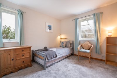 Ground floor bedroom with single bed and second roll out single to use as twin room