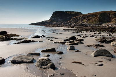 Visit Carsaig Beach at the bottom of dramatic cliffs