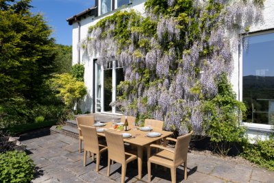 Gorgeous gardens make the setting truly magical as you enjoy dinner overlooking the loch
