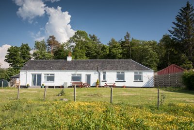 Tigh Bhan Cottage, set in a pretty garden overlooking the airfield and sea