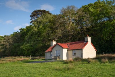 Tigh na Mara's stunning setting, backed by woodland and looking out over Loch Spelve