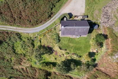 A bird's eye view of Witch's Cottage and the mature garden