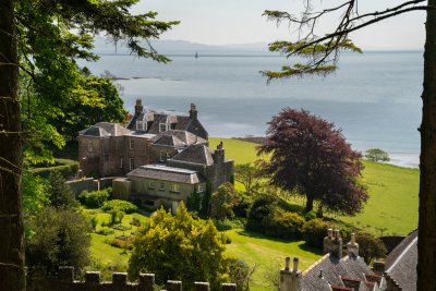A first glimpse through the forest of the majestic Carsaig House as you approach 