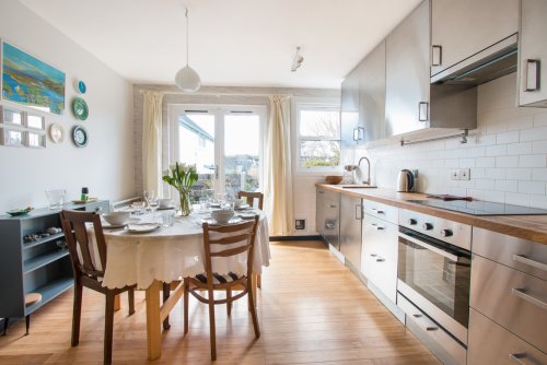 Natural light fills the kitchen and dining area