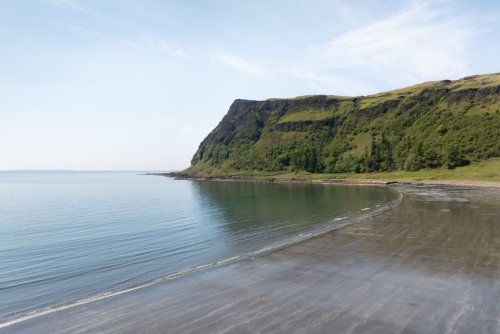 Wander down to the black sand beach across fields from the garden