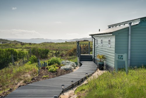 A boardwalk pathway greets you at The Sea Shanty