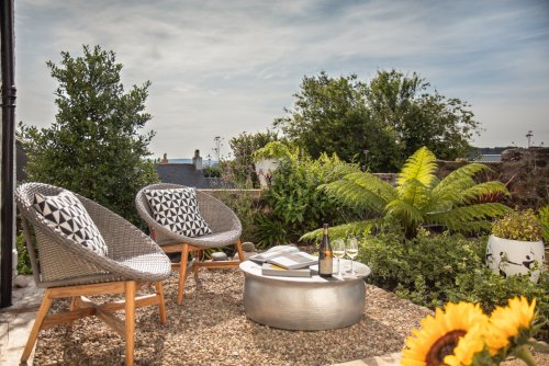 Relax with a glass of wine in the sheltered garden at The Art House
