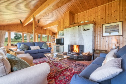 With the open fire lit, the living room truly feels the heart of the home