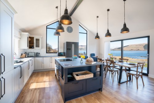 Open plan living at Balach Oir with a modern kitchen and amazing sea views