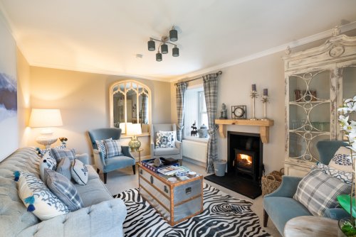 Light the wood burning stove and relax in the beautifully presented living room