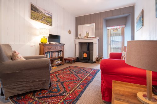 Living room with wood stove in the Bothy