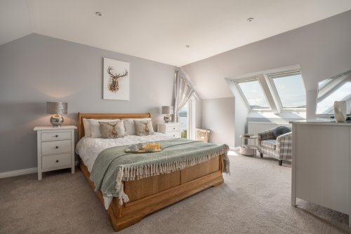 Lovely master double bedroom with neutral colours makes for a relaxing night's sleep