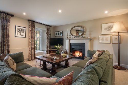 The cosy family room-meets-games room, with open fire too