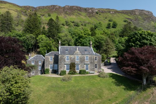 Carsaig House surrounded by its elegant gardens and grounds