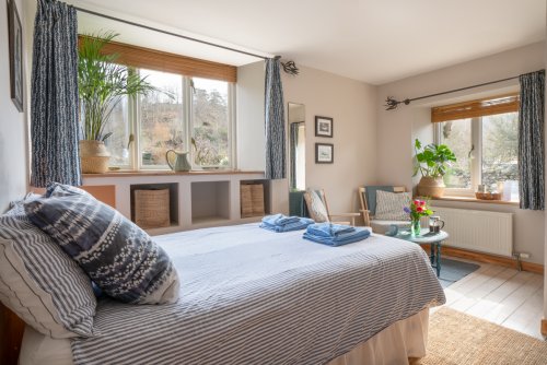 The bedroom at the Cart Studio, complete with living area too