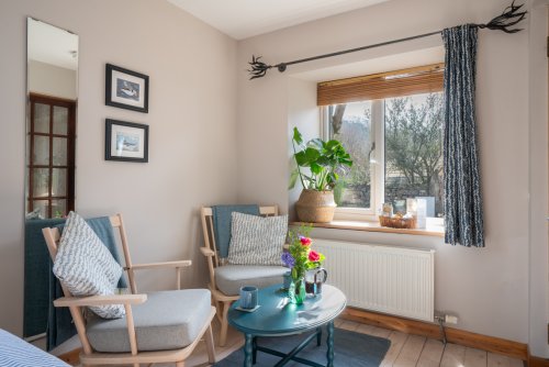 Snuggle up in the wee sitting nook and enjoy coffee for two