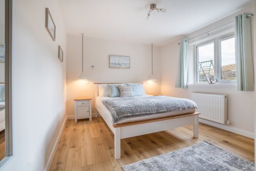 Doze off in the airy and welcoming double bedroom