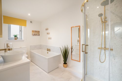 The en-suite bathroom is elegantly appointed