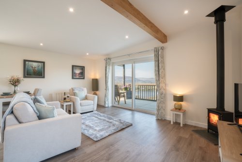 Soak up the sea views and coorie in beside the fire
