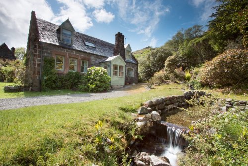 Craig Ben Cottage with burn running through the garden