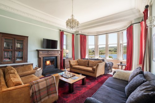 Soak up the stunning loch views from the comfortable living room