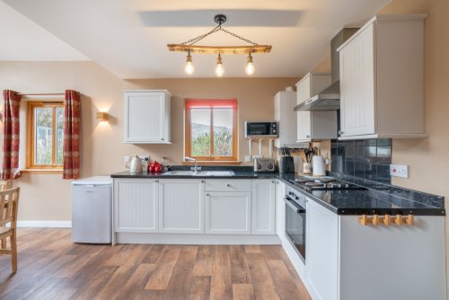 The open plan kitchen flows effortlessly onto the dining area, a great space for entertaining