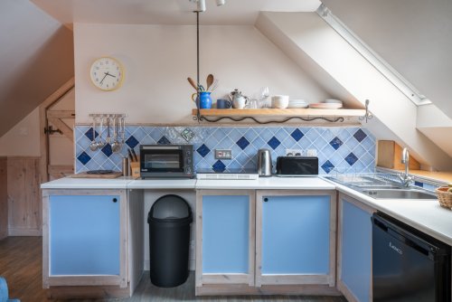 The kitchen is compact but well put together