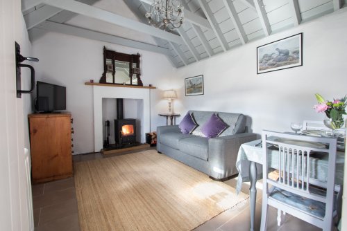 Living room in the bothy with wood burning stove