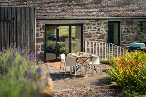 Soak up the sun from the peaceful garden sitting area