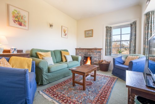 Cosy up beside the open fire after a day birdwatching or boating