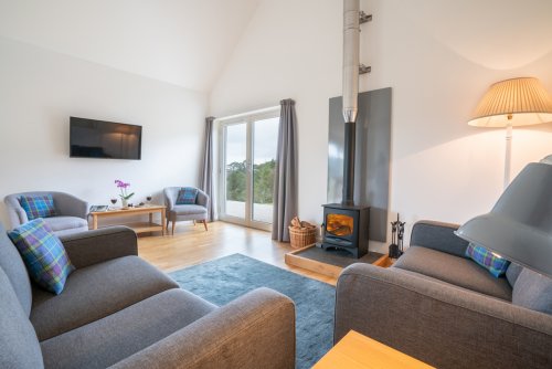 Space and comfort in the well appointed living area with doors out to the decking